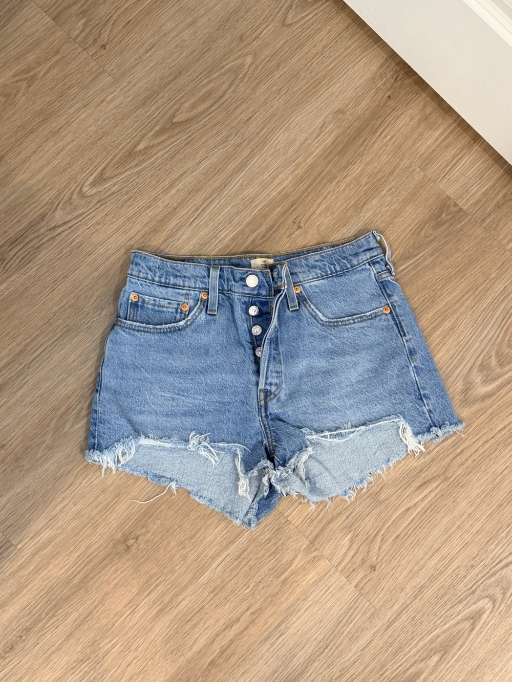 Levi's Medium Light Blue Frayed High-Rise Denim Shorts